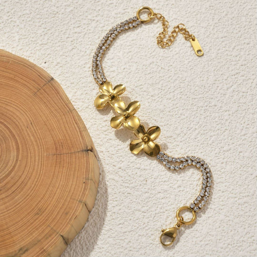 18K Gold Plated Stainless Steel Flower Bracelet on a wite background 