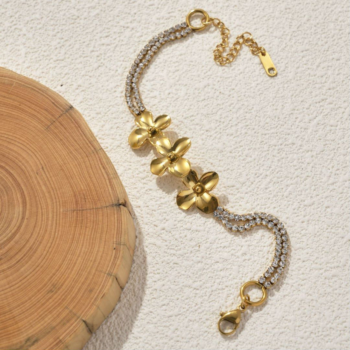 18K Gold Plated Stainless Steel Flower Bracelet on a wite background 