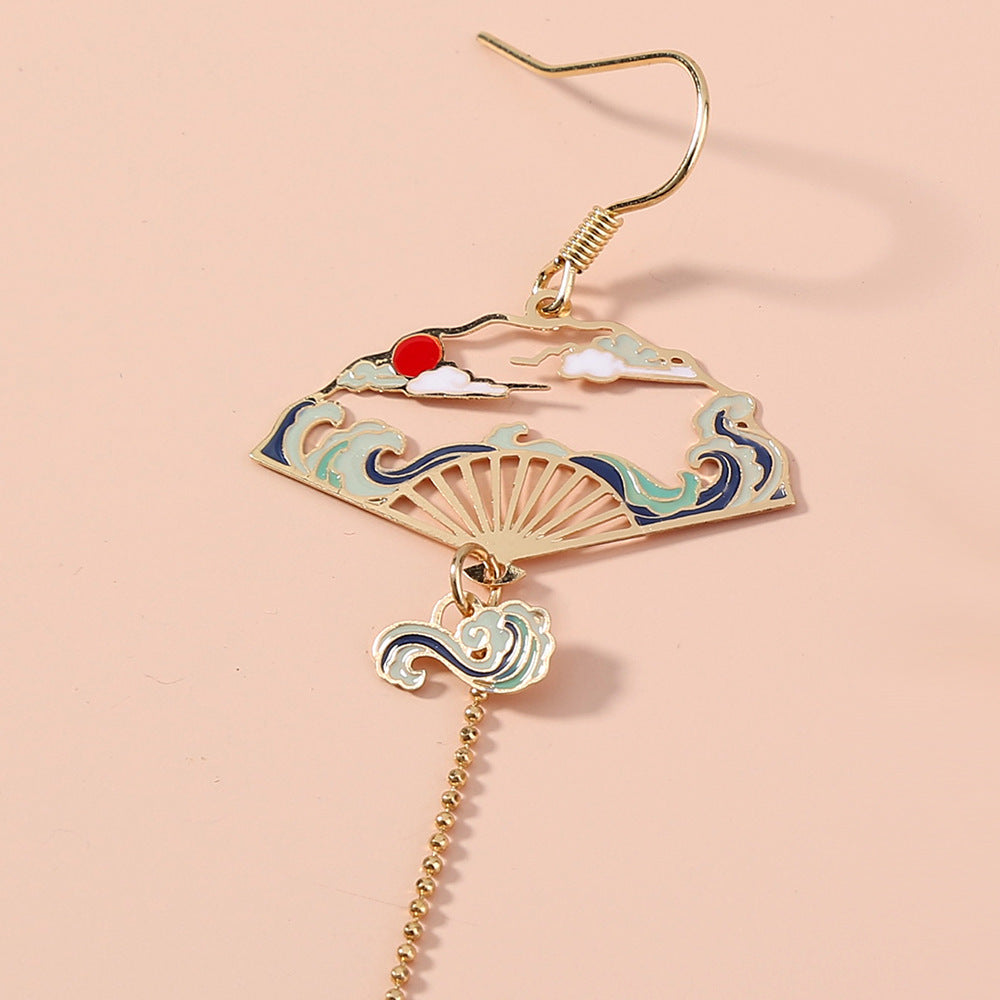 Boucles d'oreilles asymétriques grue émaillée plaqué or 18 carats