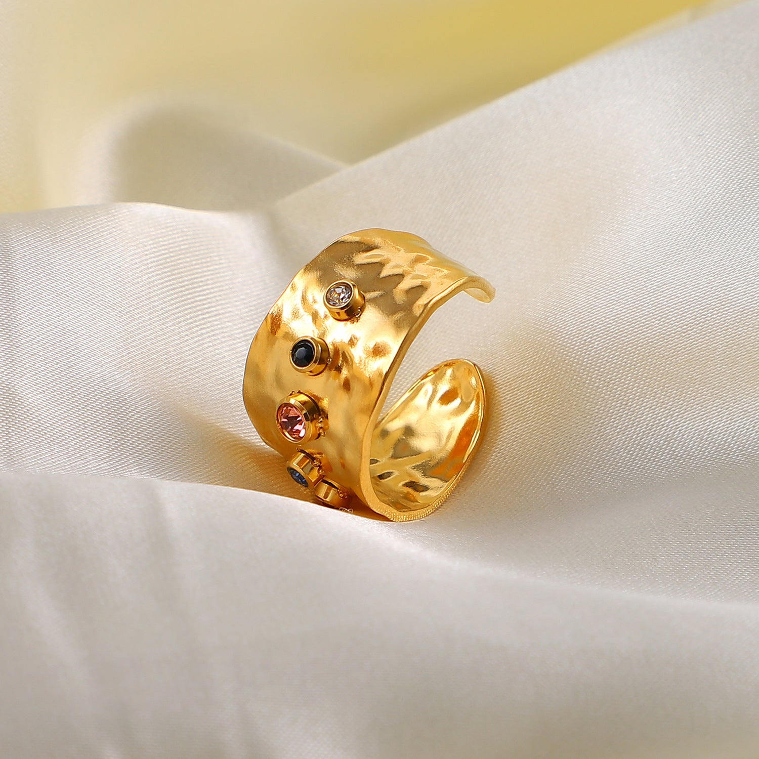 18K Gold Plated Stainless Steel Adjustable Ring on a lan material 
