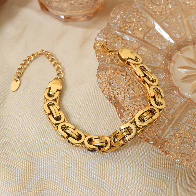 Bracelet maille en acier titane plaqué or 18 carats