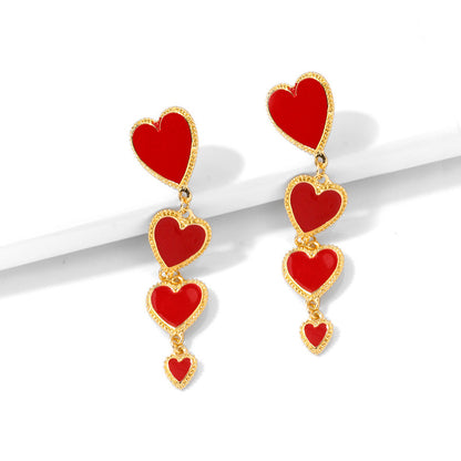 Boucles d'oreilles à pampilles longues avec pendentif en forme de cœur rouge en émail imbriqué pour femmes