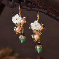 Boucles d'oreilles longues antiques à étal au sol