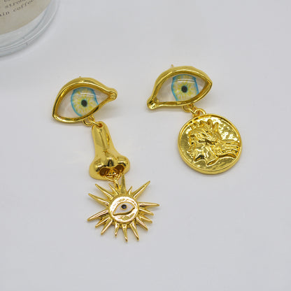 Boucles d'oreilles soleil style rétro vintage en forme d'oeil d'or