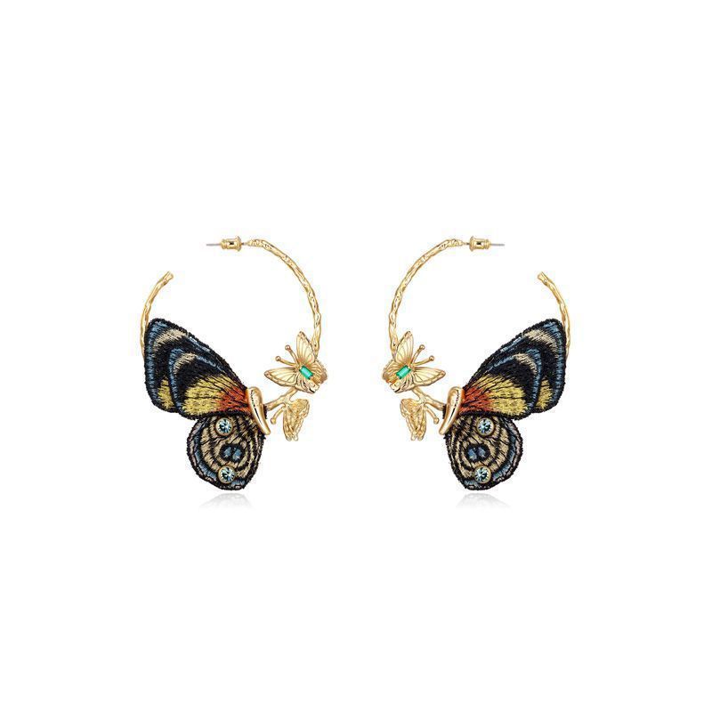 Boucles d'oreilles en cuivre avec broderie papillon