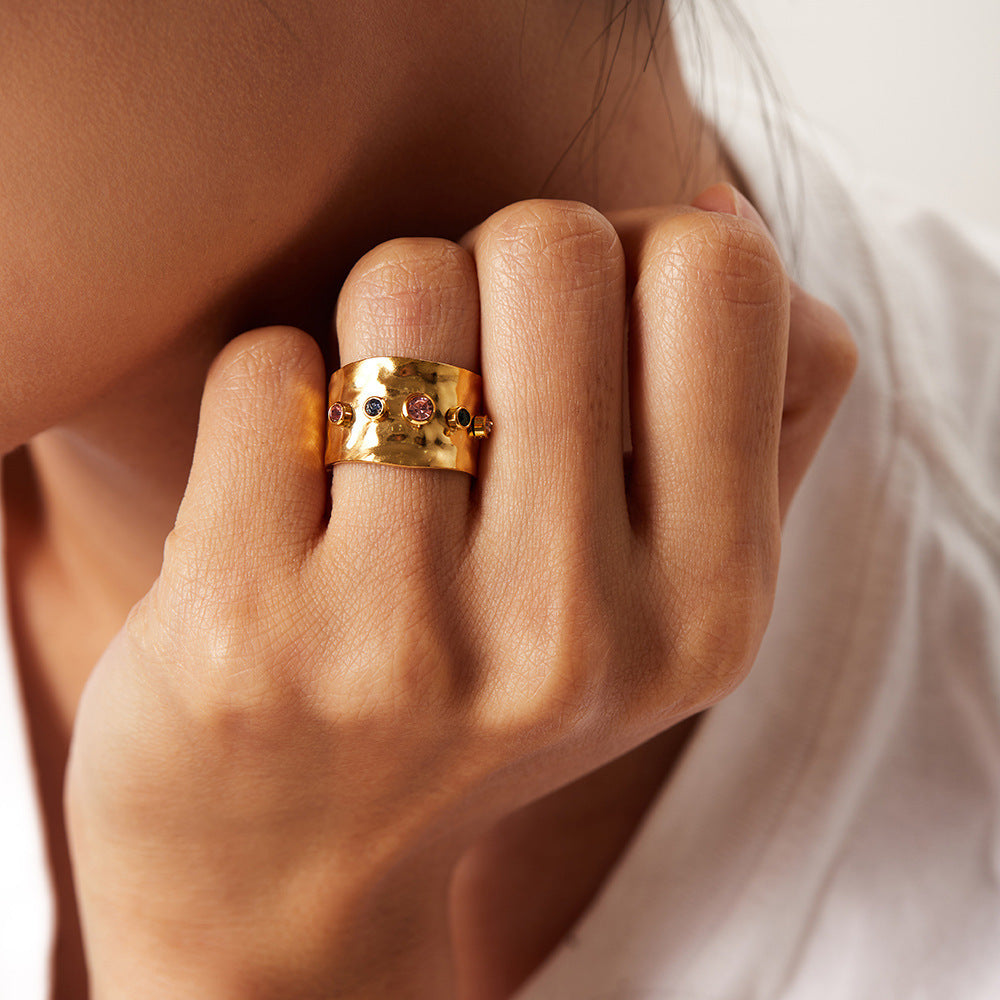 a female hand with 18K Gold Plated Stainless Steel Adjustable Ring